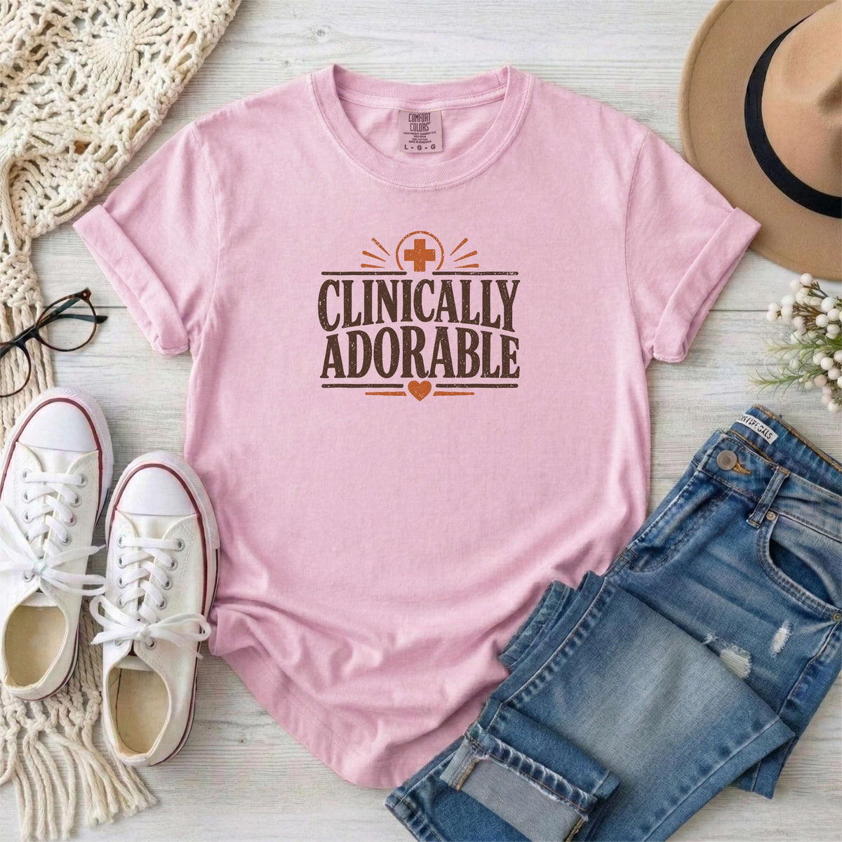 Blossom garment-dyed cotton tee printed with "Clinically Adorable".