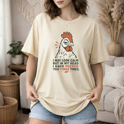 Ivory garment-dyed cotton tee printed with "I May Look Calm But In My Head I Have Pecked You Three Times".