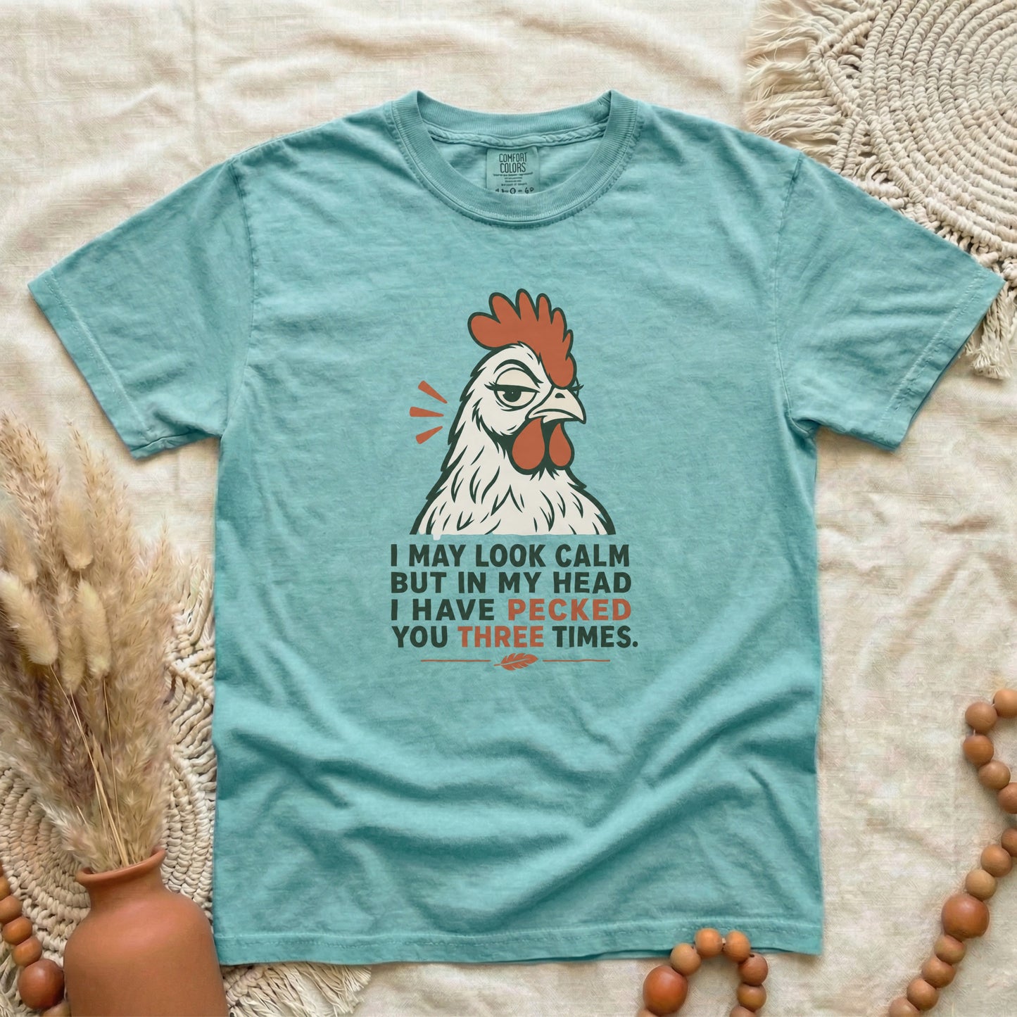 Chalky Mint garment-dyed cotton tee printed with "I May Look Calm But In My Head I Have Pecked You Three Times".