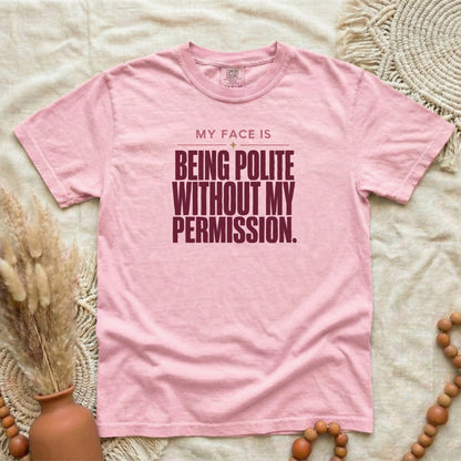 Blossom garment-dyed cotton tee printed with "My Face Is Being Polite Without My Permission".