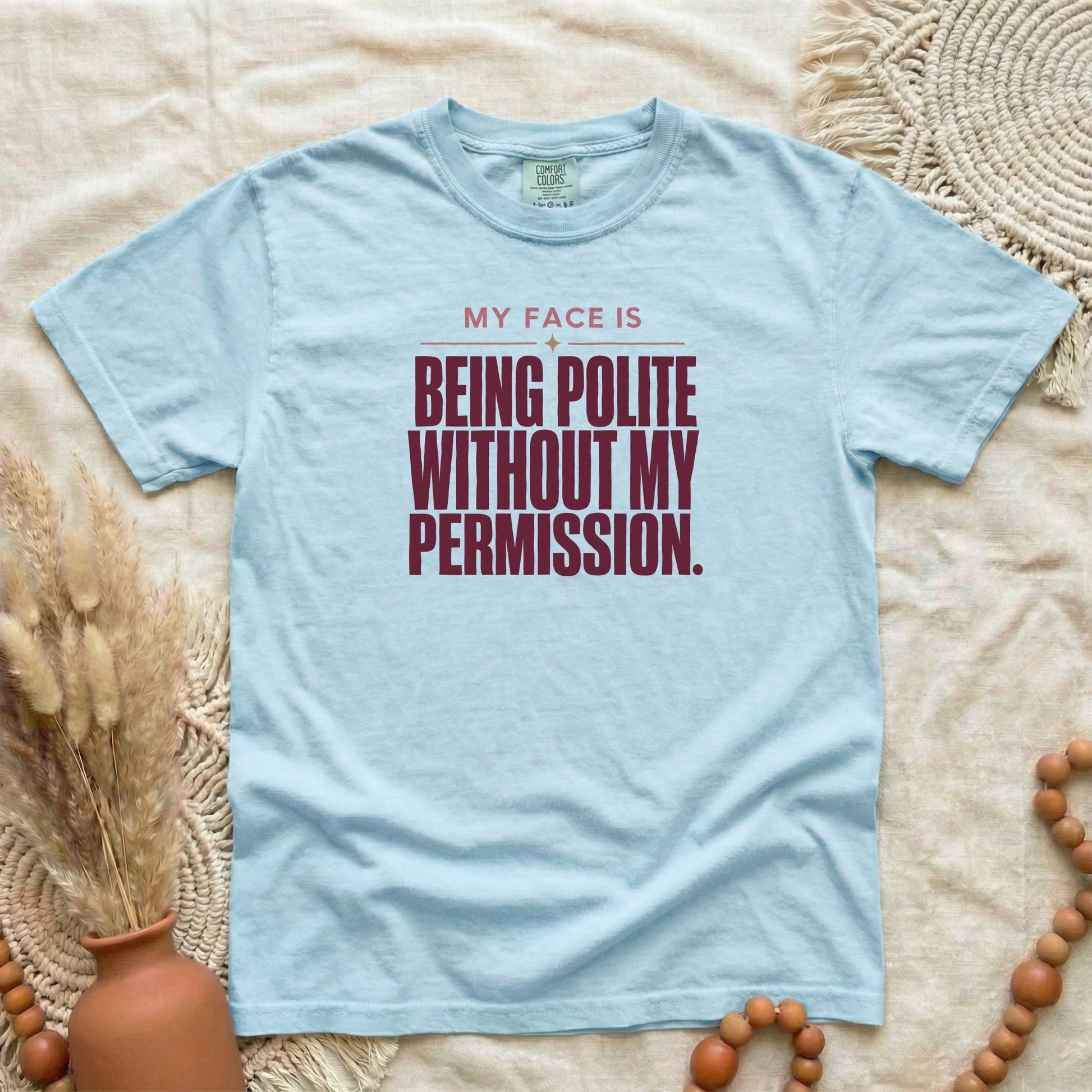 Chambray garment-dyed cotton tee printed with "My Face Is Being Polite Without My Permission".