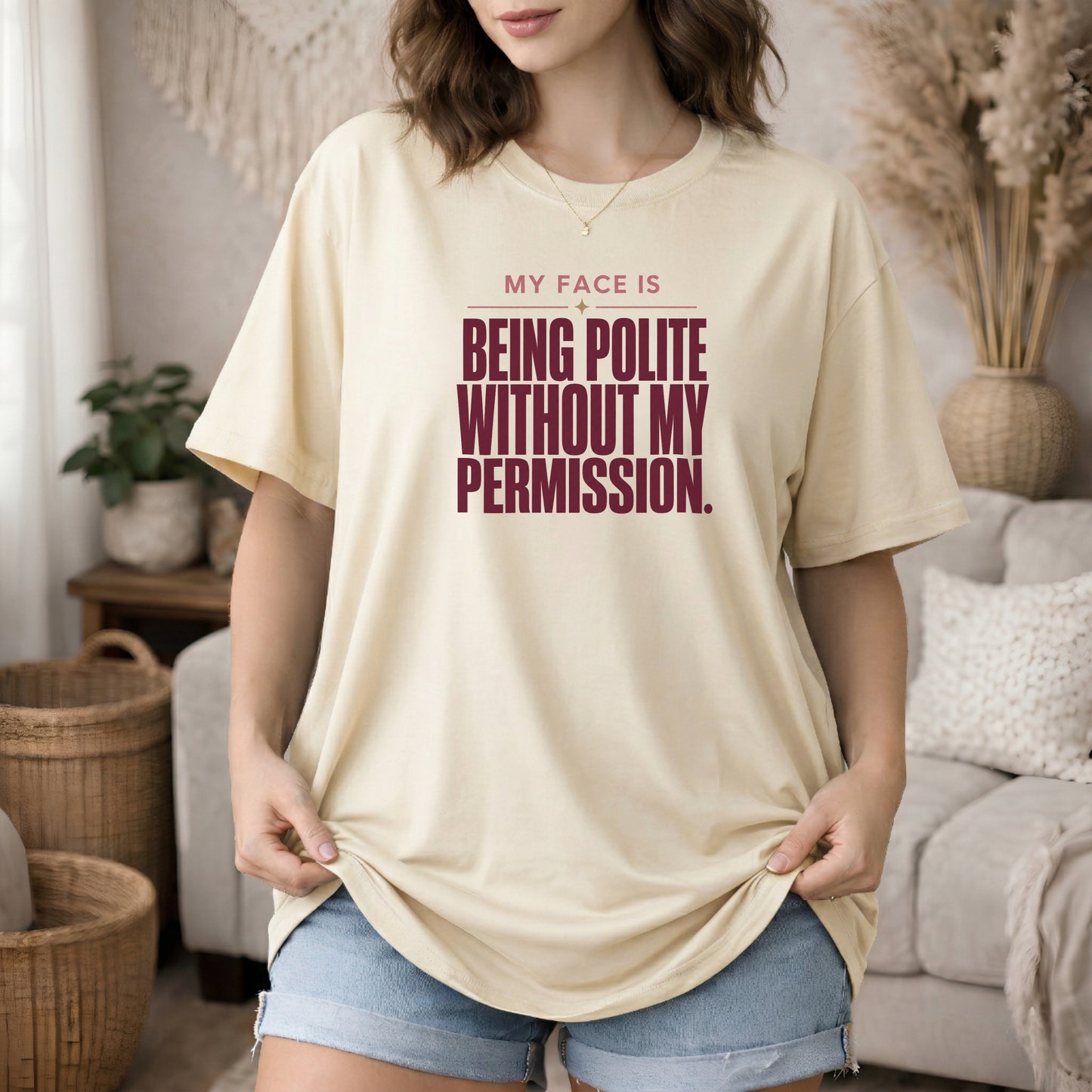 Ivory garment-dyed cotton tee printed with "My Face Is Being Polite Without My Permission".