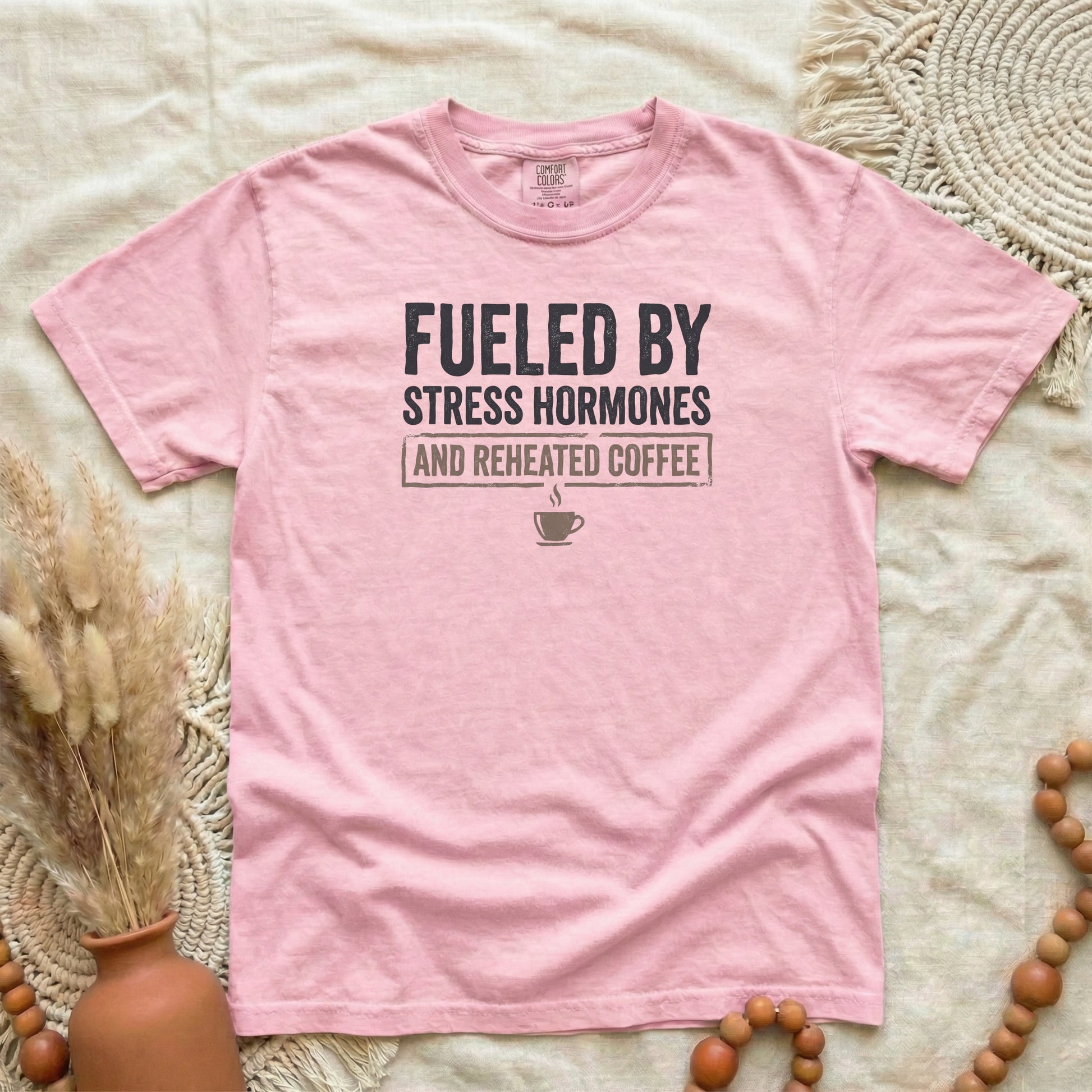 Blossom garment-dyed cotton tee printed with "Fueled By Stress Hormones And Reheated Coffee".