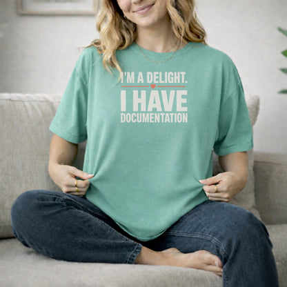 Island Green garment-dyed cotton tee printed with "I'm A Delight. I Have Documentation."