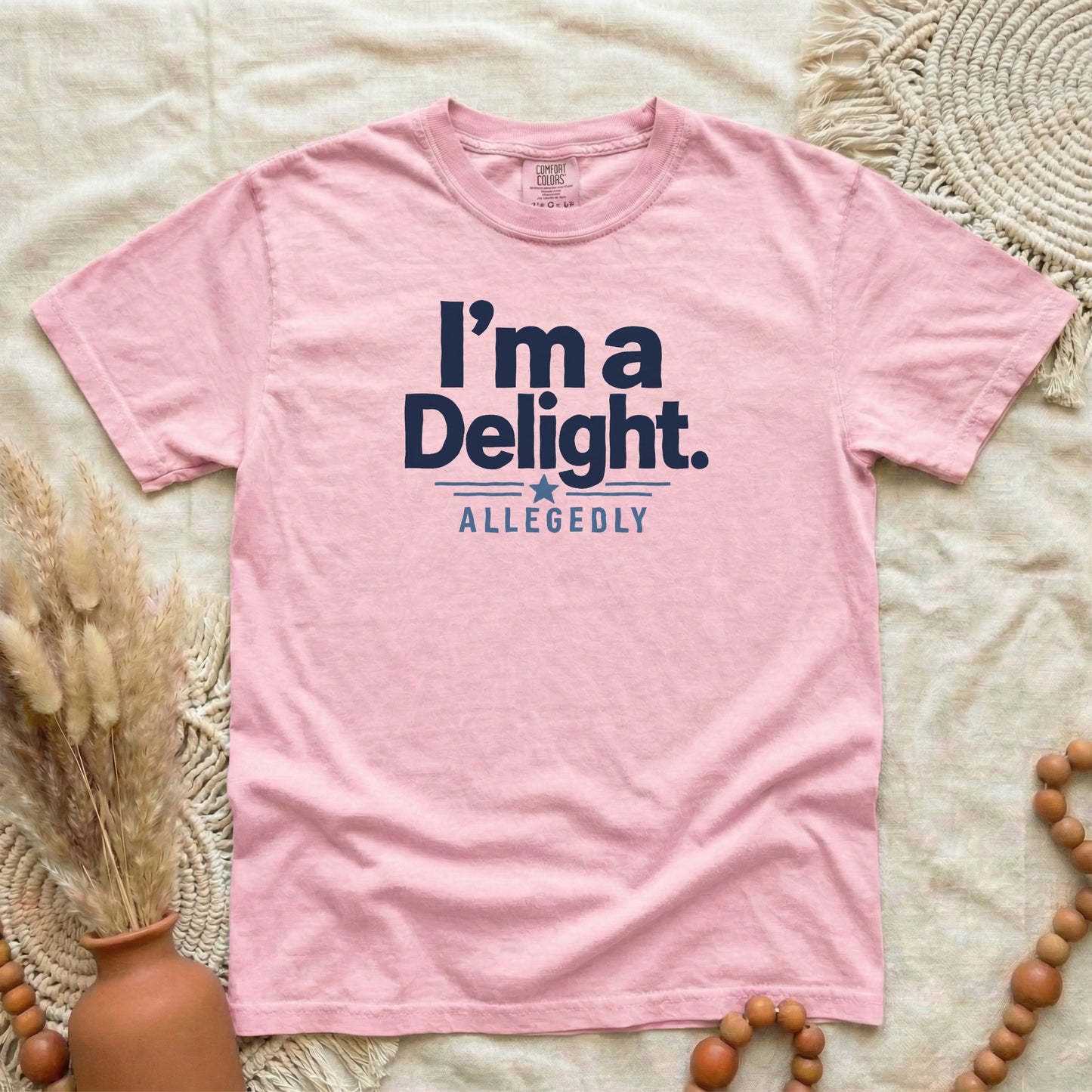 Blossom garment-dyed cotton tee printed with "I'm A Delight, Allegedly".