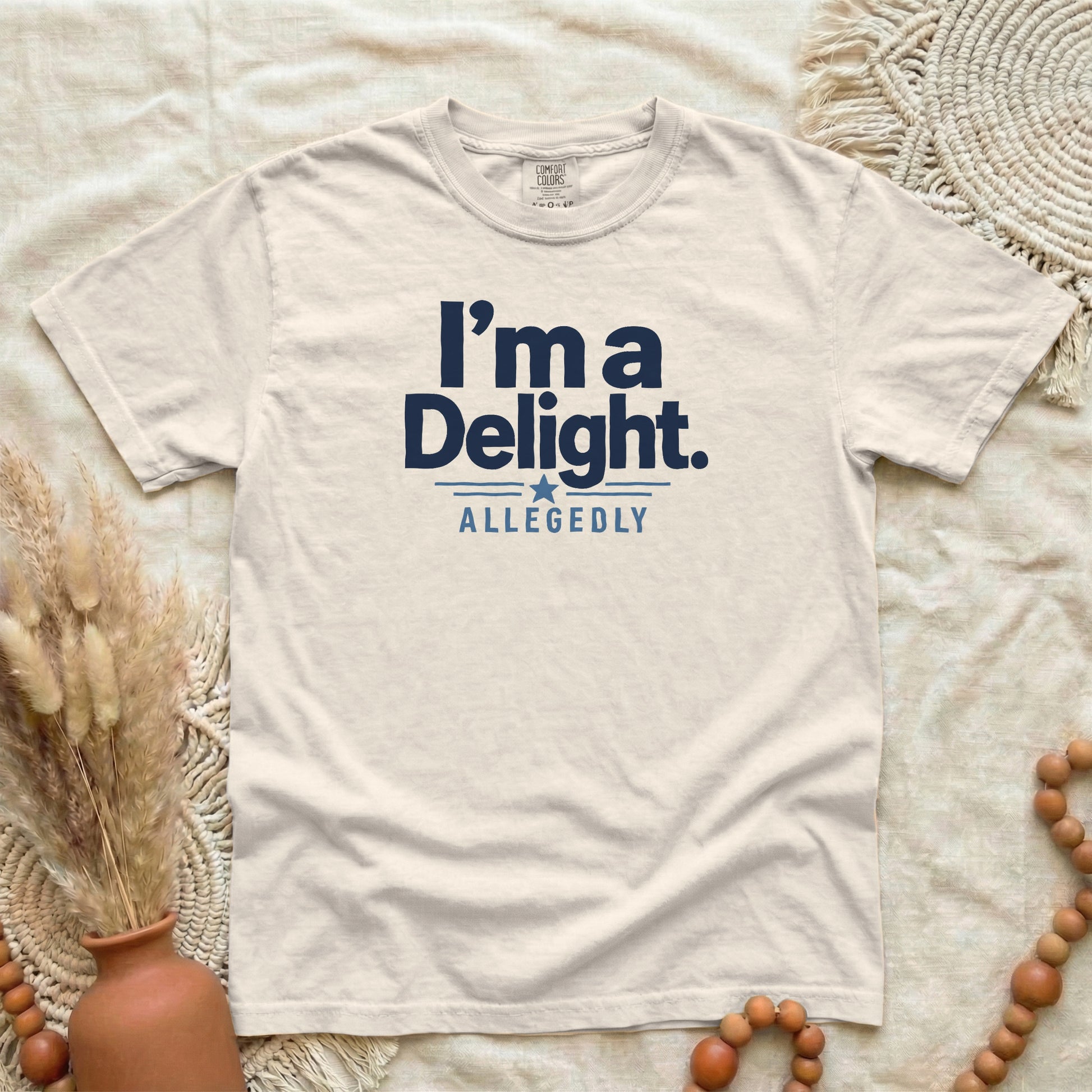 Ivory garment-dyed cotton tee printed with "I'm A Delight, Allegedly".