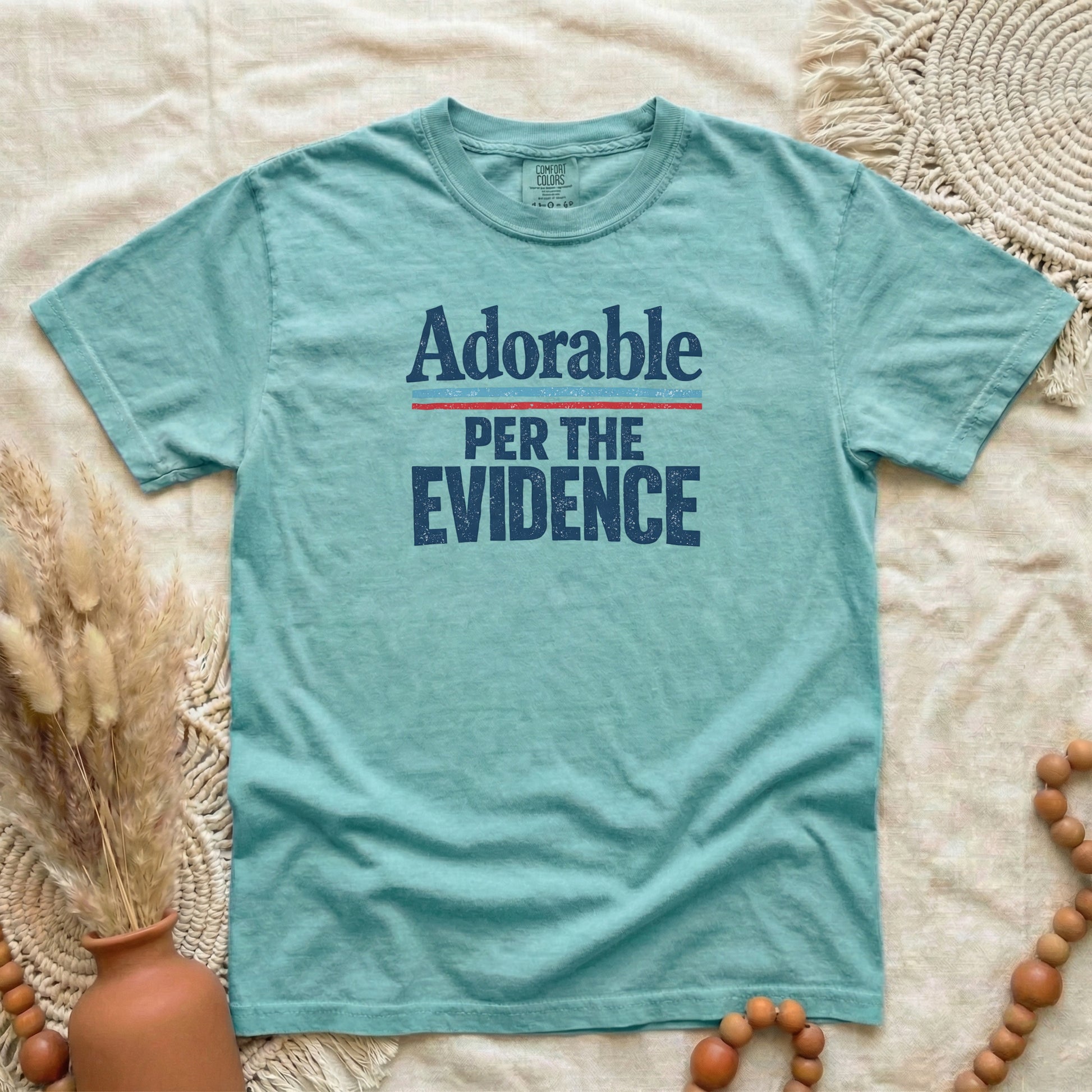 Chalky Mint garment-dyed cotton tee printed with "Adorable, Per The Evidence".