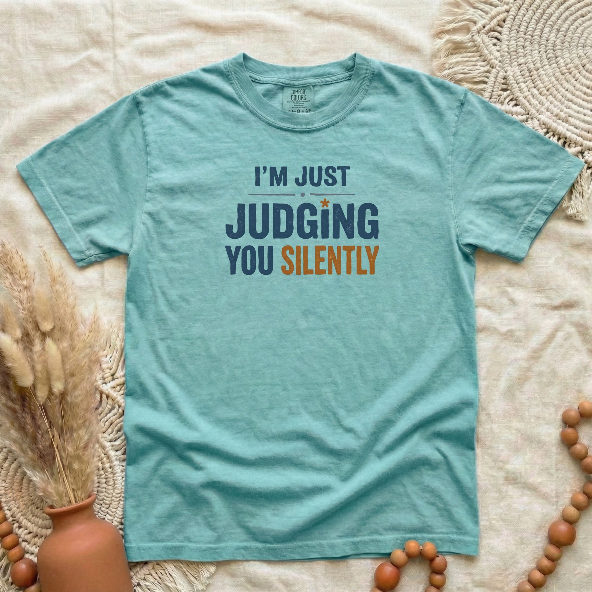 Chalky Mint garment-dyed cotton tee printed with "Judging You Silently".