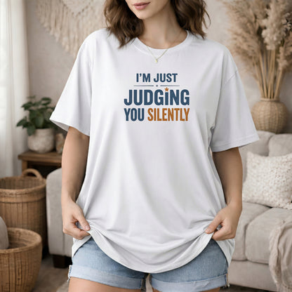 White garment-dyed cotton tee printed with "Judging You Silently".