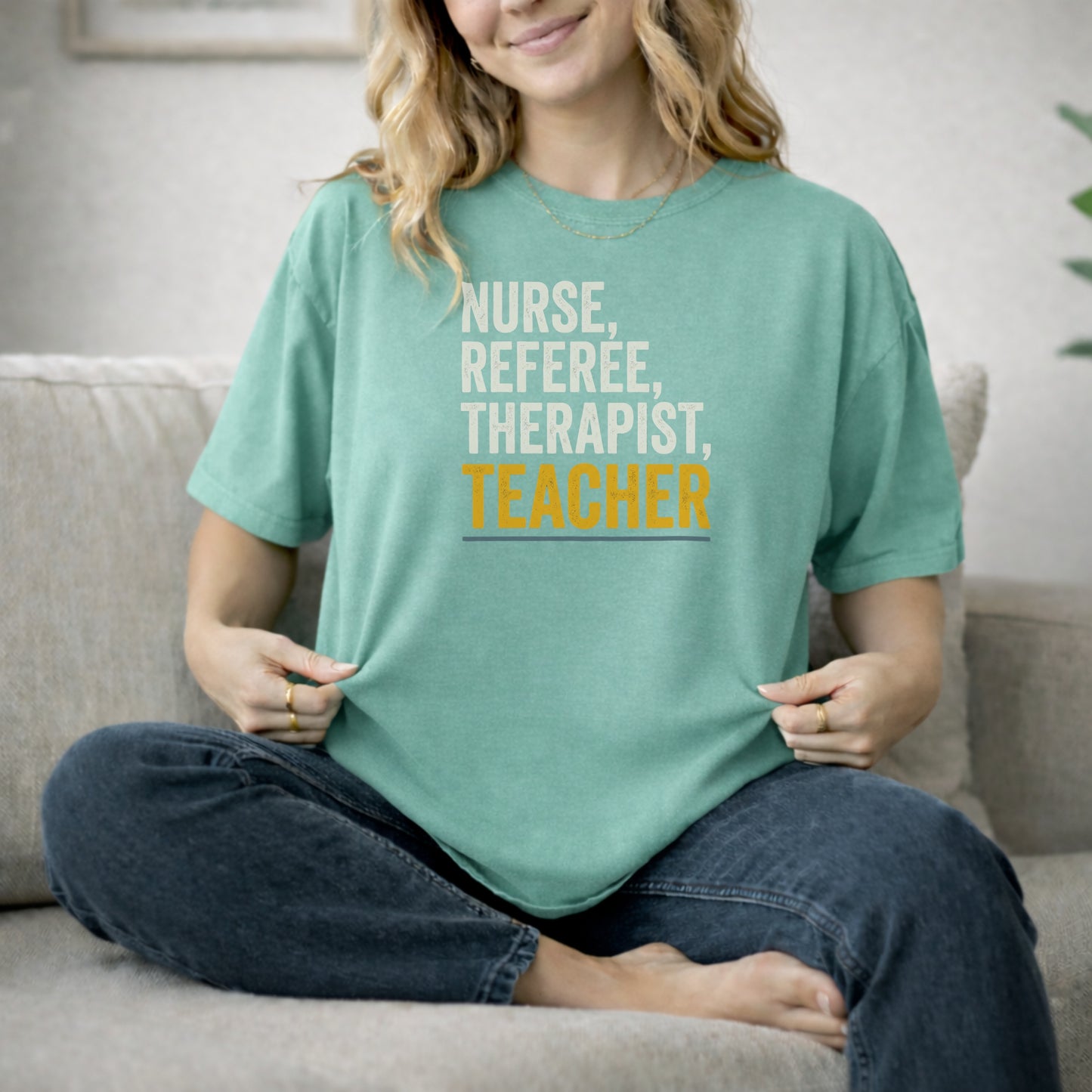 Seafoam garment-dyed cotton tee printed with "Nurse, Referee, Therapist, Teacher".