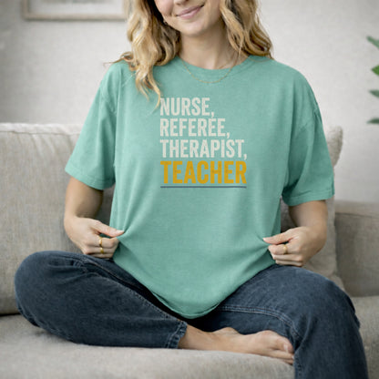 Seafoam garment-dyed cotton tee printed with "Nurse, Referee, Therapist, Teacher".