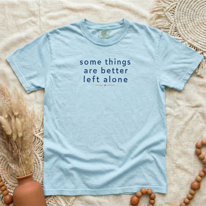 Chambray garment-dyed cotton tee printed with "Some Things Are Better Left Alone".