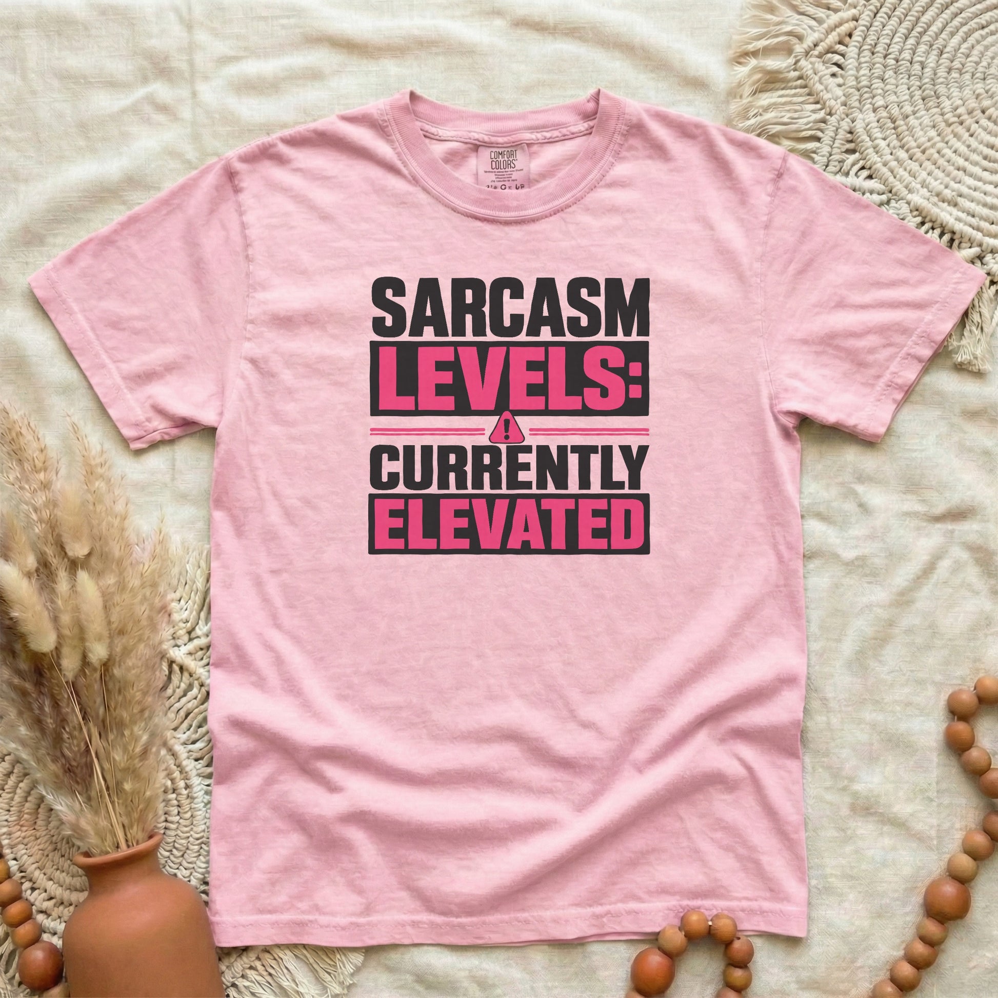 Blossom garment-dyed cotton tee printed with "Sarcasm Levels: Currently Elevated".
