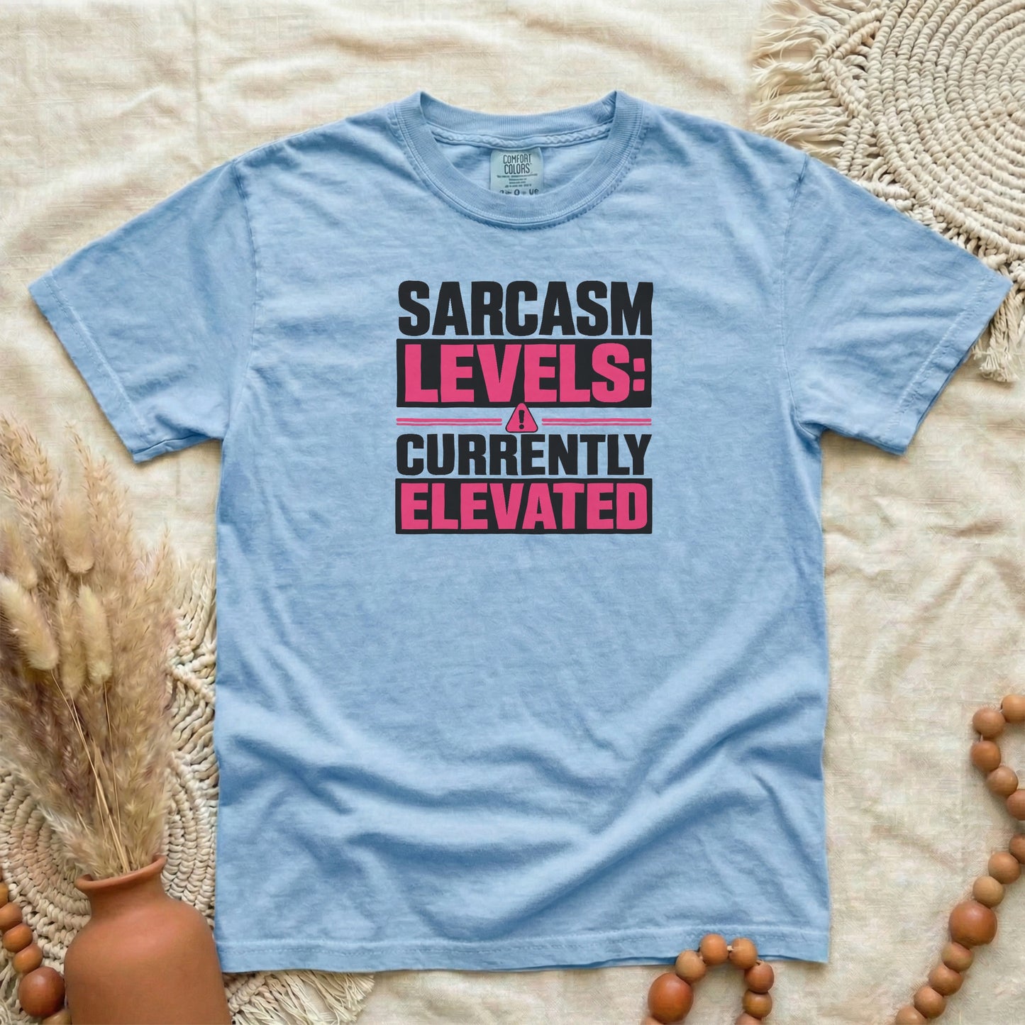 Washed Denim garment-dyed cotton tee printed with "Sarcasm Levels: Currently Elevated".