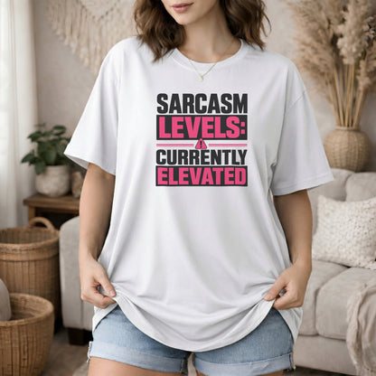 White garment-dyed cotton tee printed with "Sarcasm Levels: Currently Elevated".