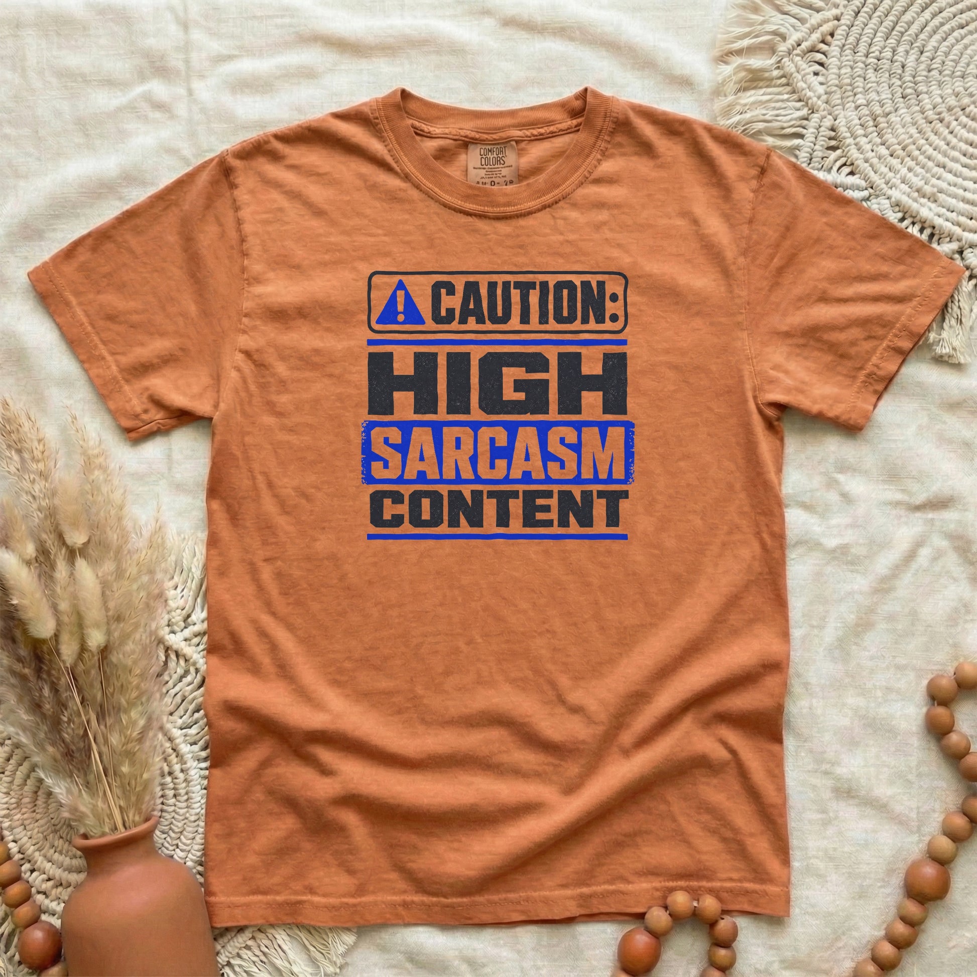 Yam garment-dyed cotton tee printed with "Caution: High Sarcasm Content".