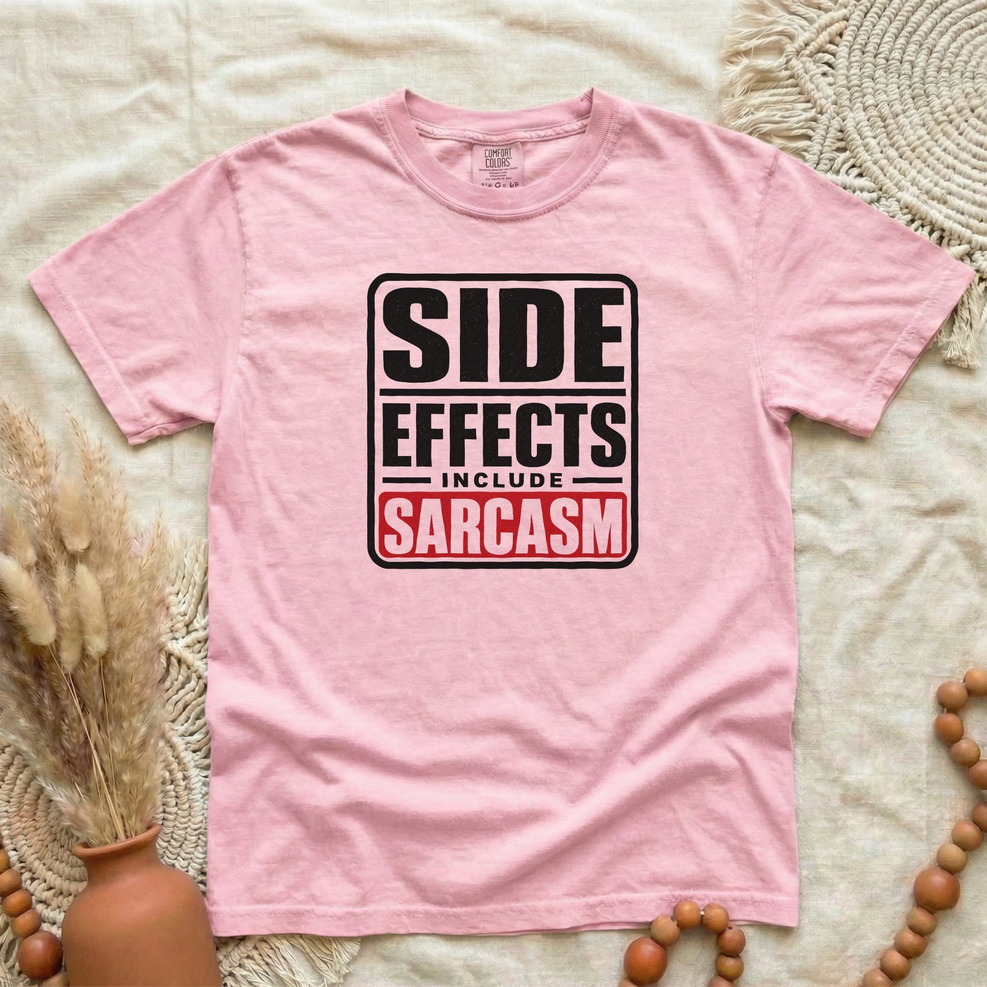 Blossom garment-dyed cotton tee printed with "Side Effects Include Sarcasm".