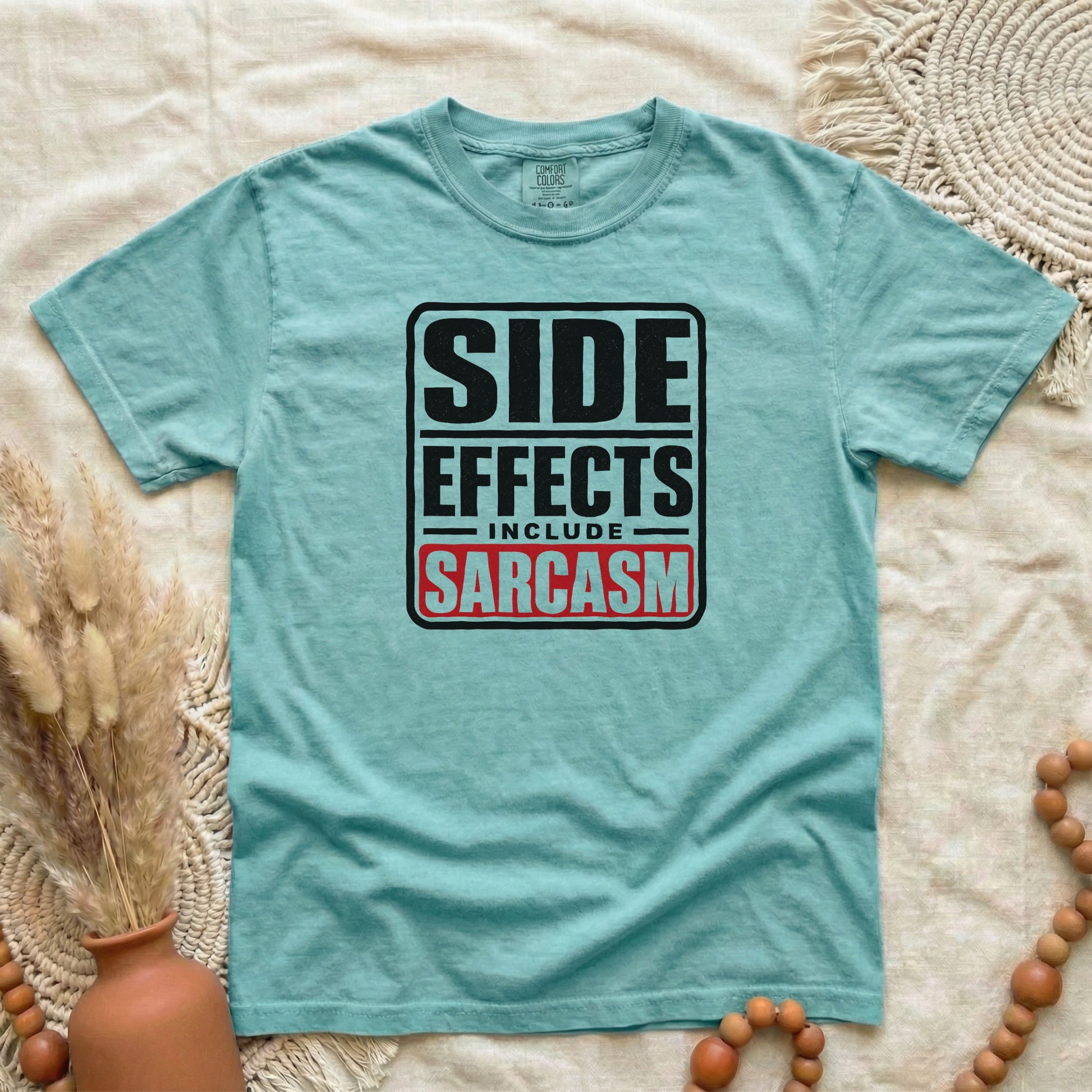 Chalky Mint garment-dyed cotton tee printed with "Side Effects Include Sarcasm".
