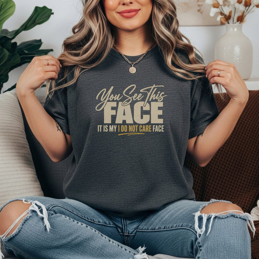Pepper garment-dyed cotton tee printed with "You See This Face, It Is My I Do Not Care Face".