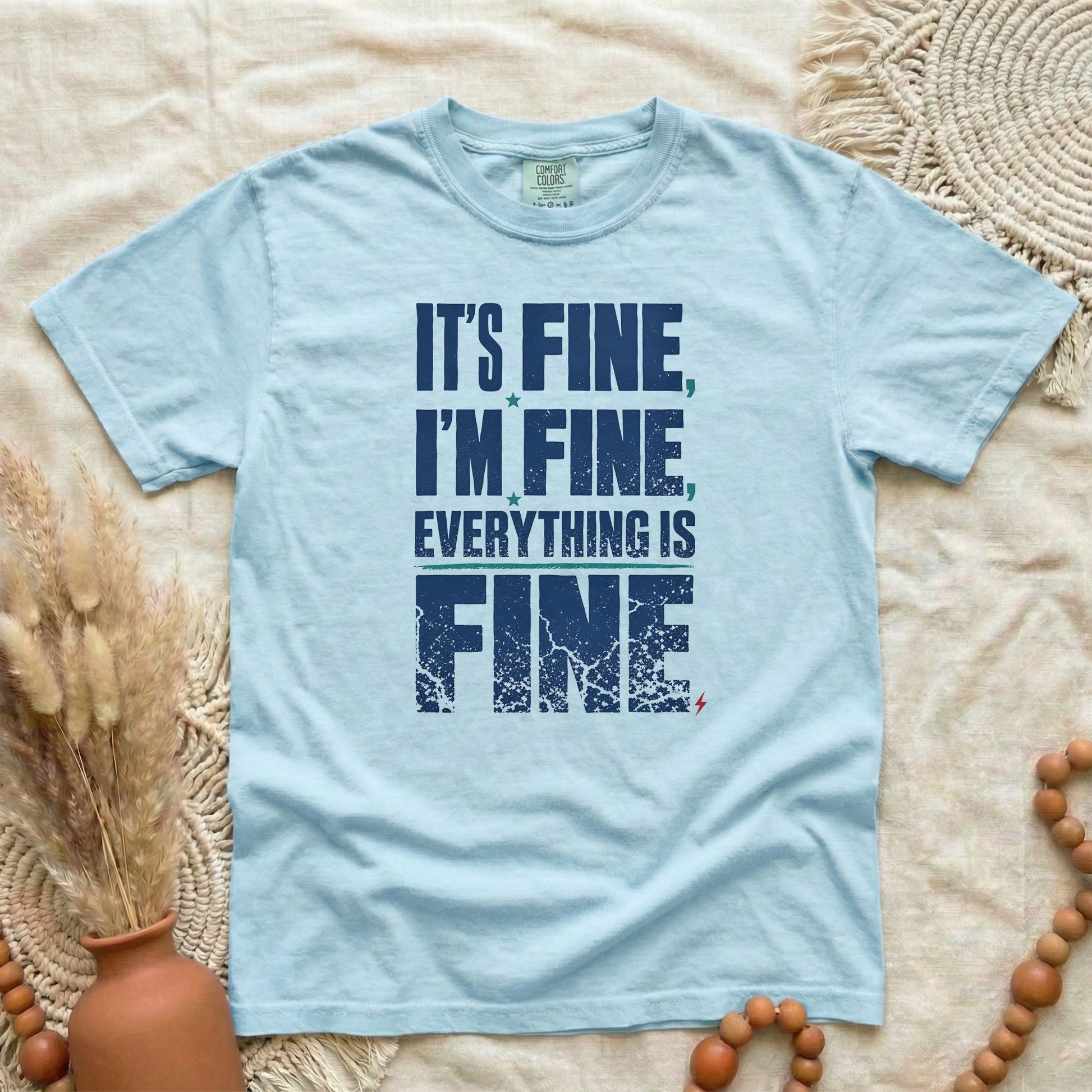 Chambray garment-dyed cotton tee printed with "It's Fine, I'm Fine, Everything Is Fine".