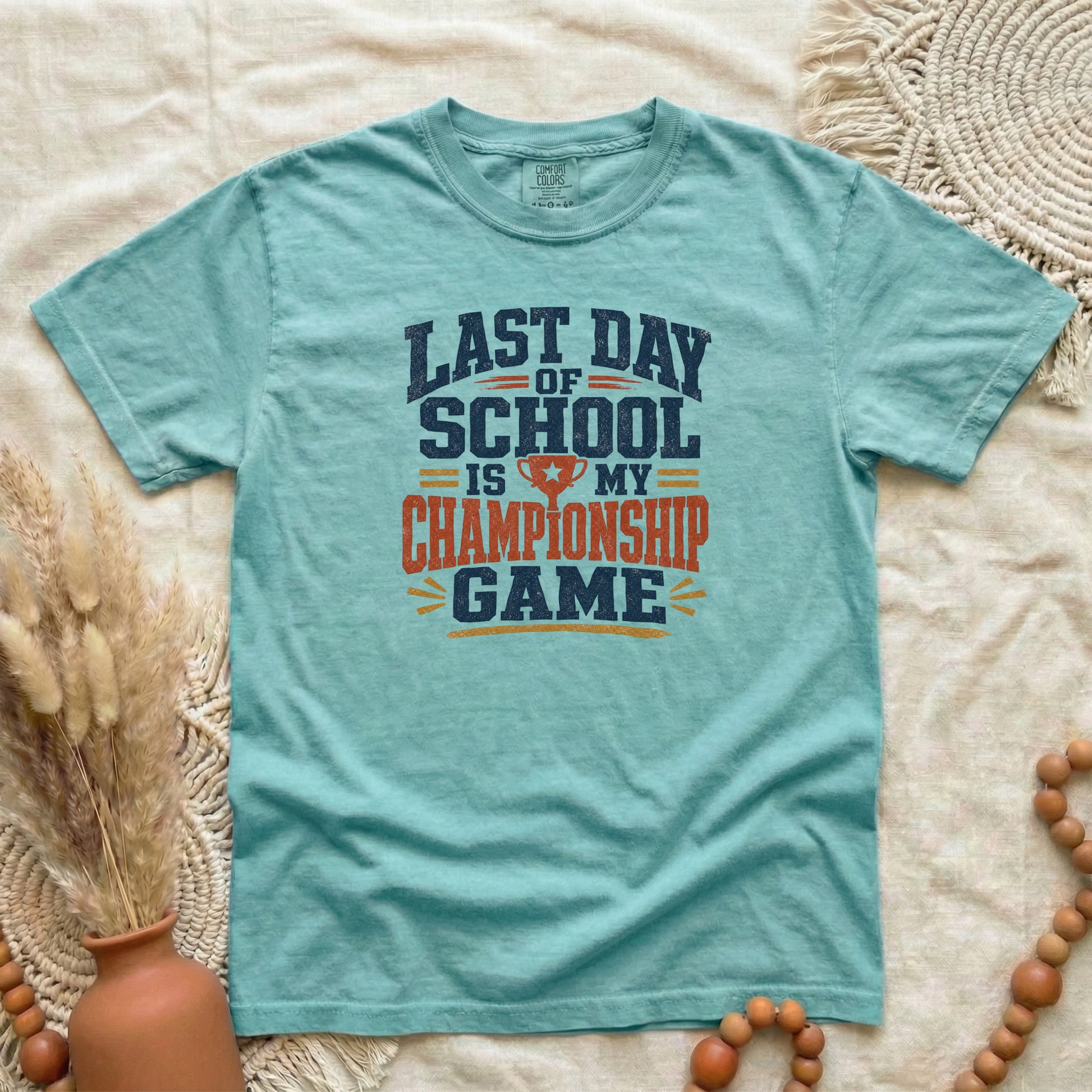 Chalky Mint garment-dyed cotton tee printed with "Last Day Of School Is My Championship Game".