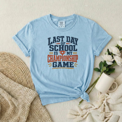 Chambray garment-dyed cotton tee printed with "Last Day Of School Is My Championship Game".