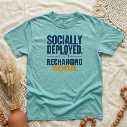 Chalky Mint garment-dyed cotton tee printed with "Socially Deployed. Recharging Soon."