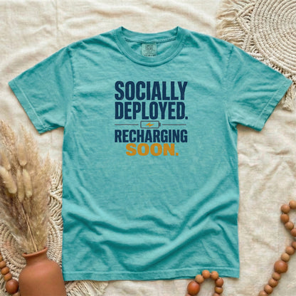 Seafoam garment-dyed cotton tee printed with "Socially Deployed. Recharging Soon."
