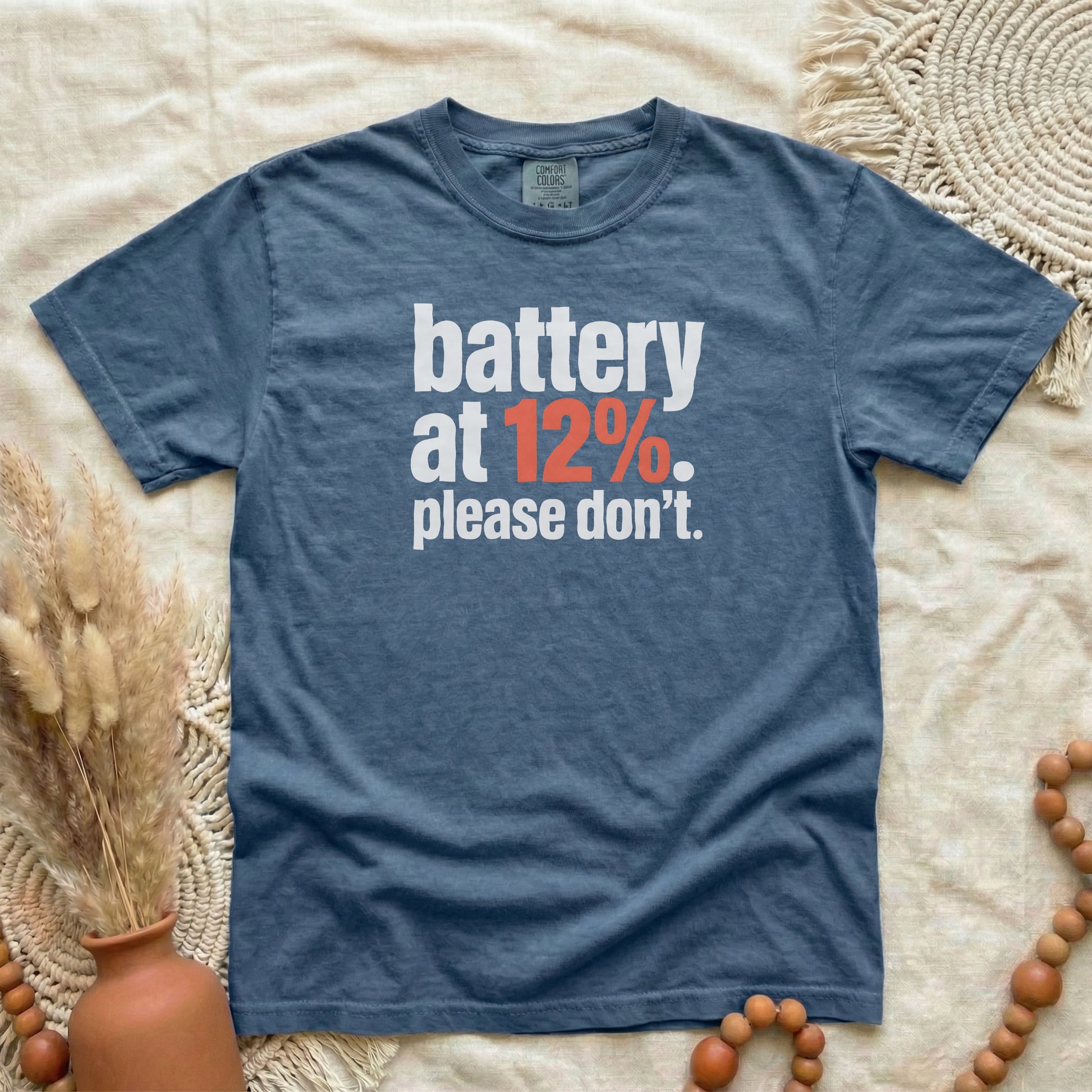 Denim garment-dyed cotton tee printed with "Battery At 12%. Please Don't."