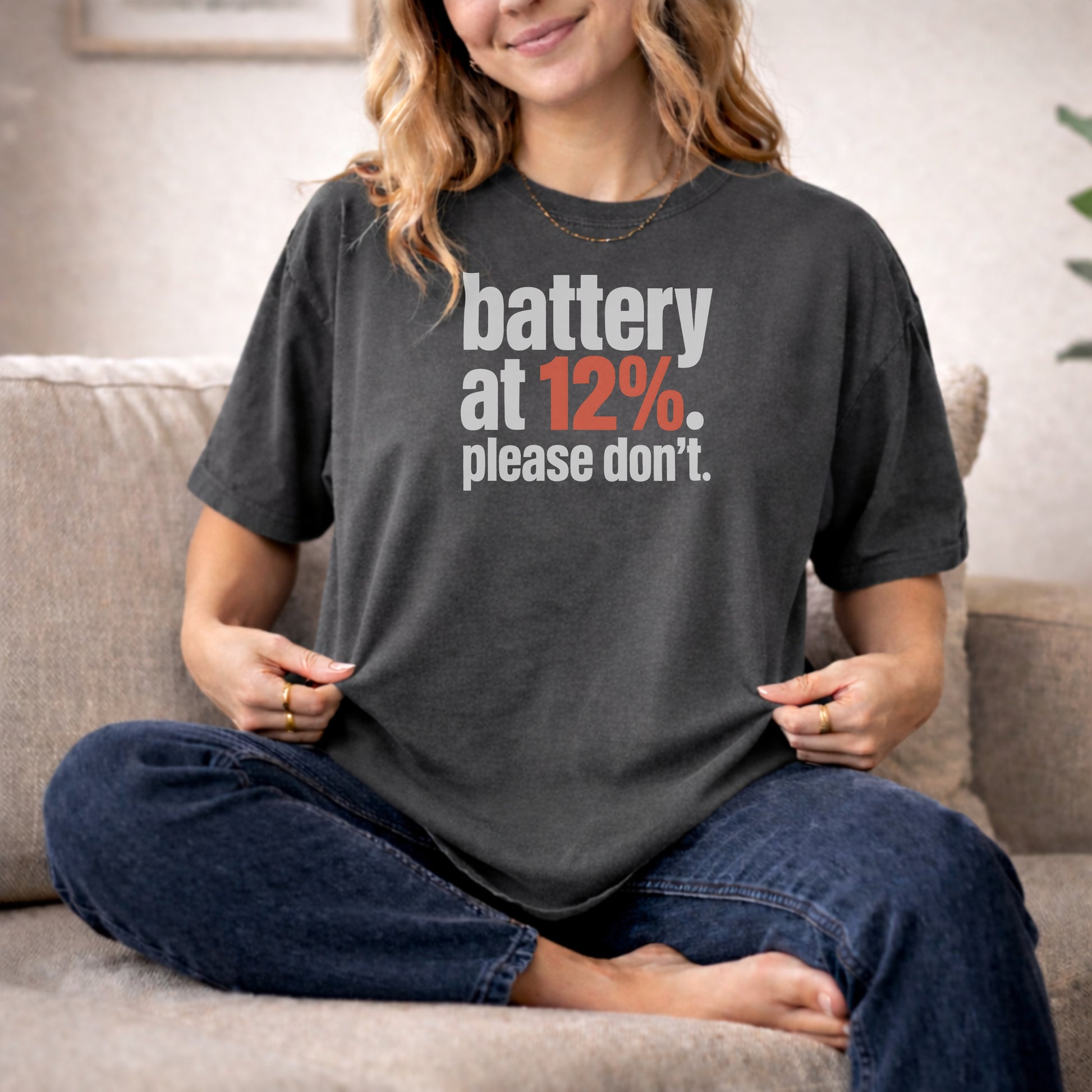 Pepper garment-dyed cotton tee printed with "Battery At 12%. Please Don't."