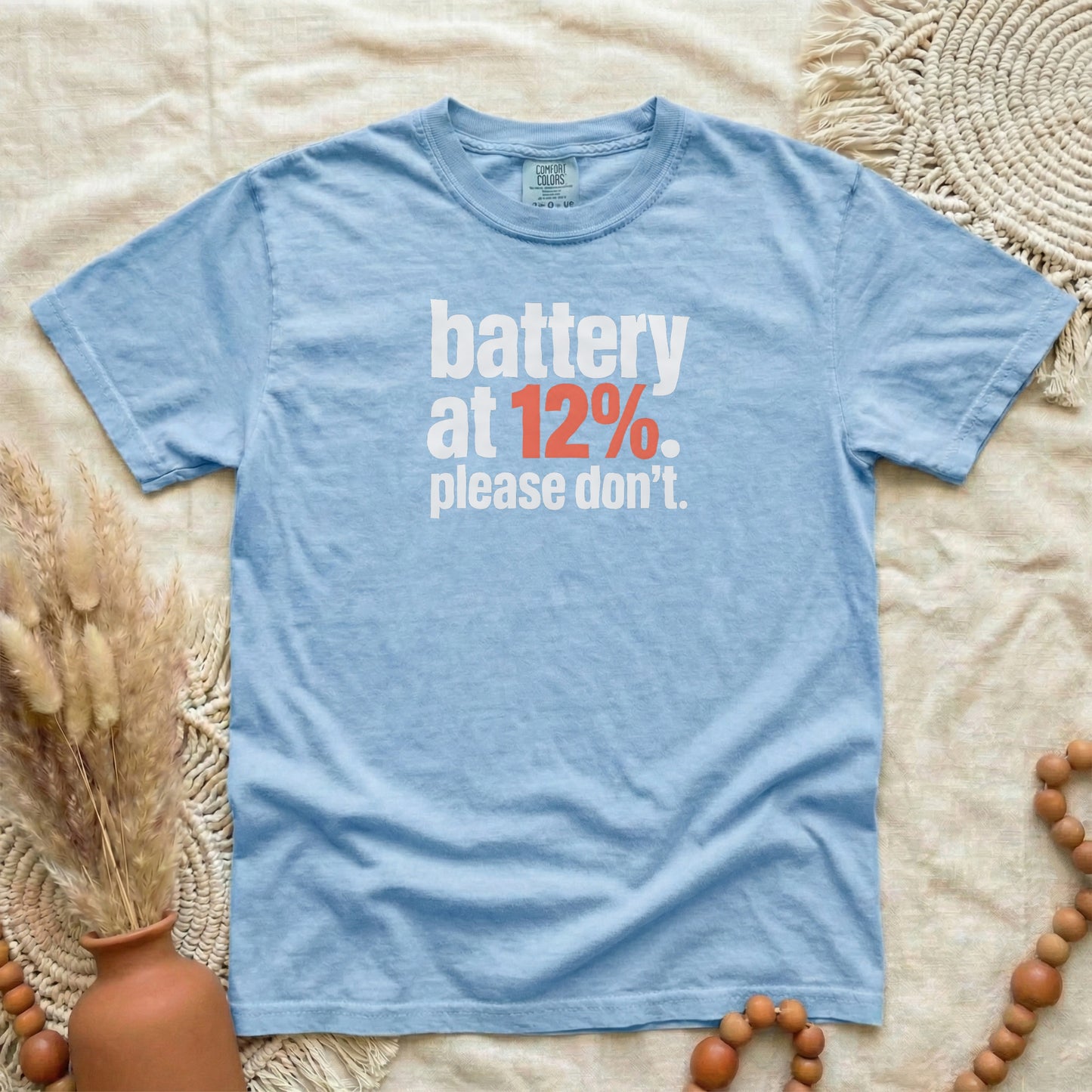 Washed Denim garment-dyed cotton tee printed with "Battery At 12%. Please Don't."
