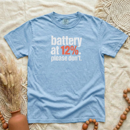 Washed Denim garment-dyed cotton tee printed with "Battery At 12%. Please Don't."