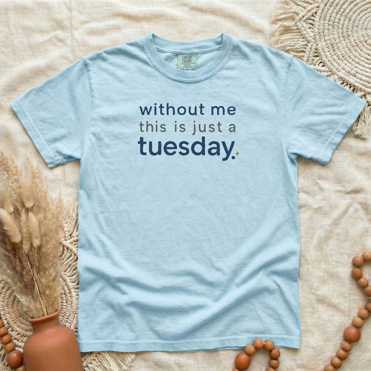 Chambray garment-dyed cotton tee printed with "Without Me This Is Just A Tuesday".