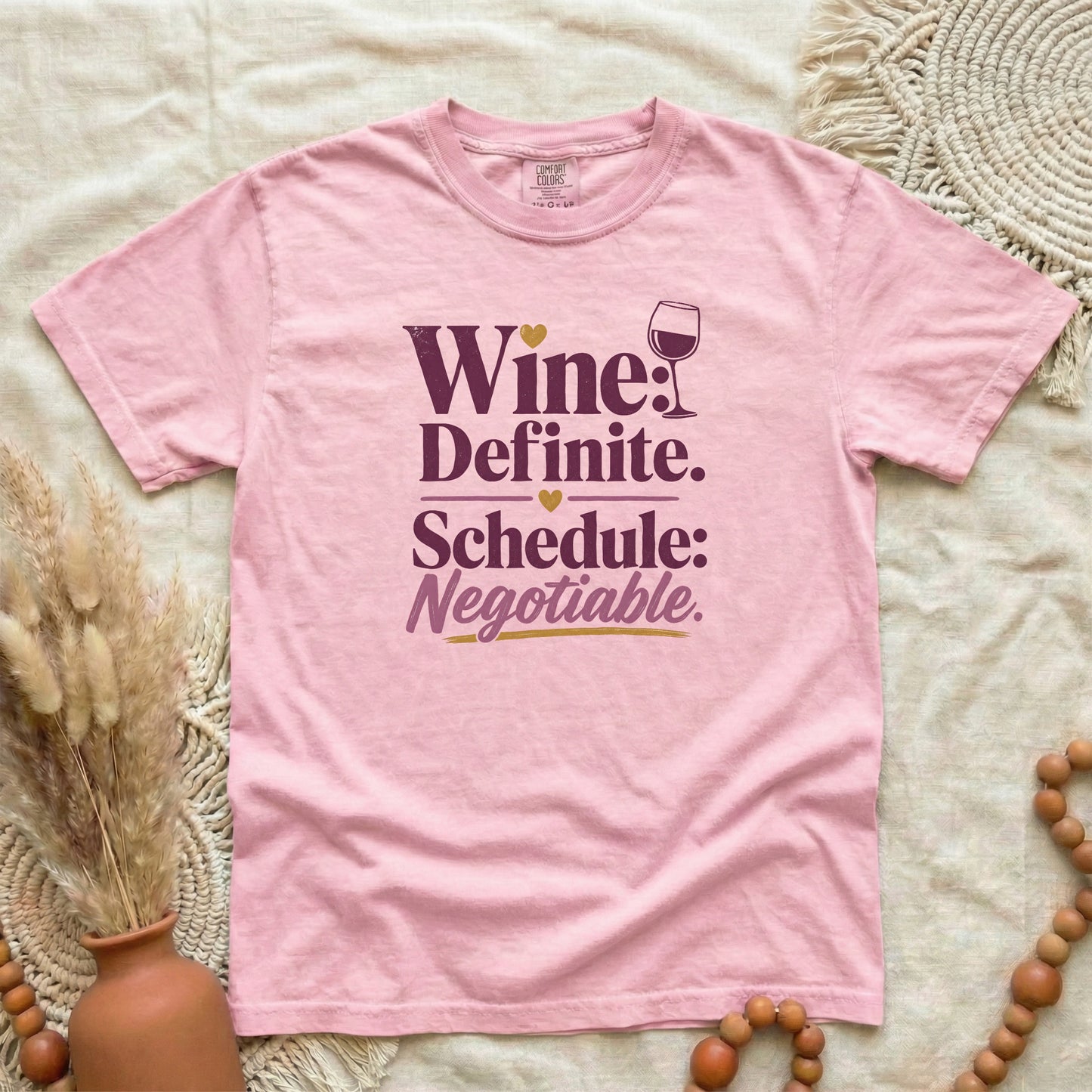 Blossom garment-dyed cotton tee printed with "Wine: Definite. Schedule: Negotiable."