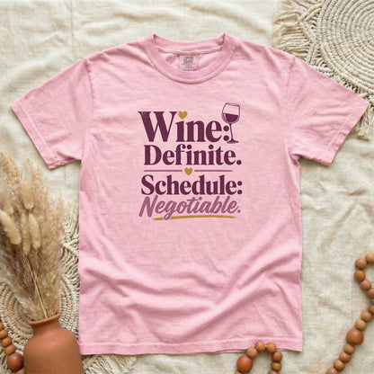 Blossom garment-dyed cotton tee printed with "Wine: Definite. Schedule: Negotiable."
