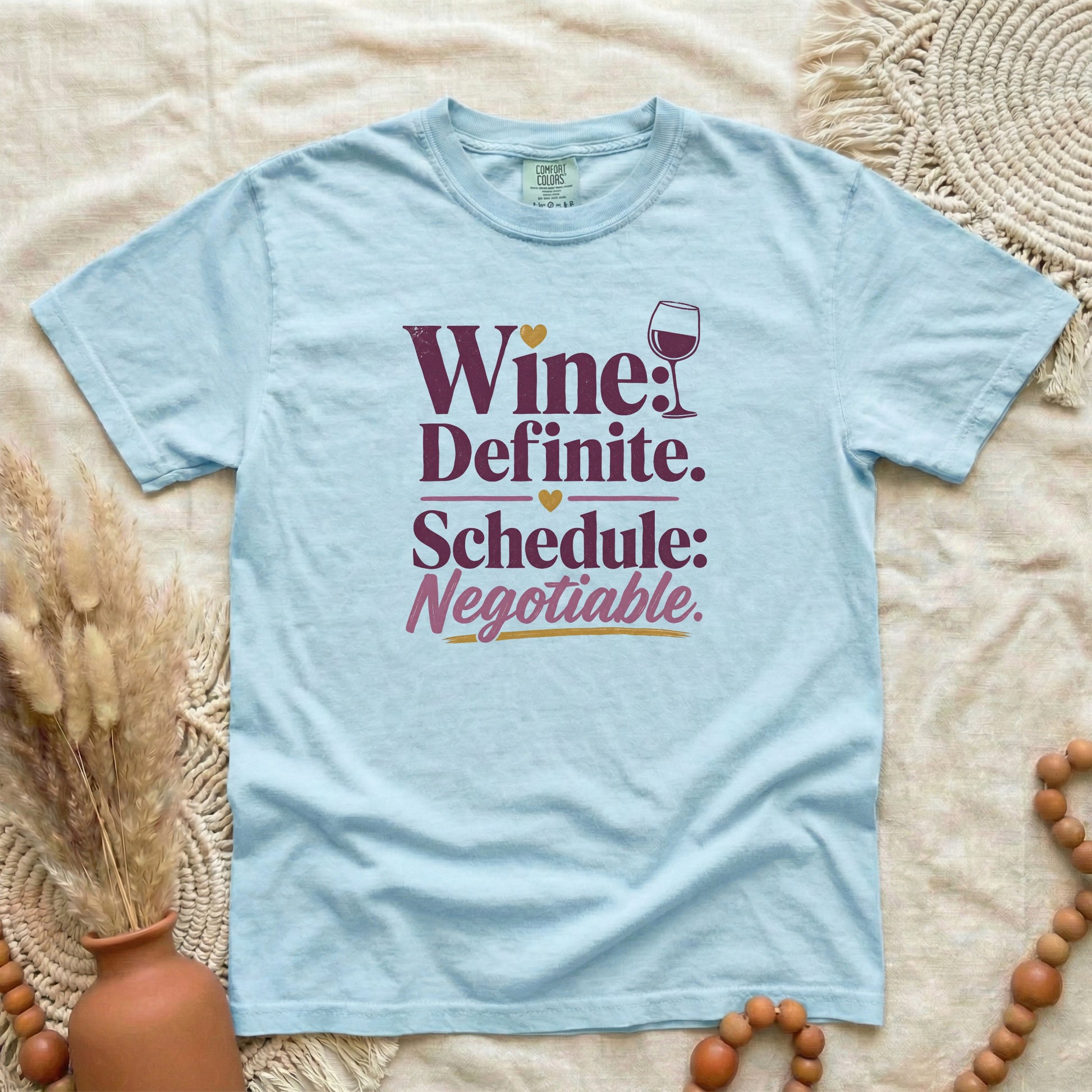 Chambray garment-dyed cotton tee printed with "Wine: Definite. Schedule: Negotiable."