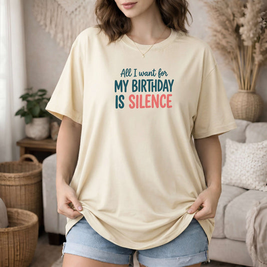 Ivory garment-dyed cotton tee printed with "All I Want For My Birthday Is Silence".