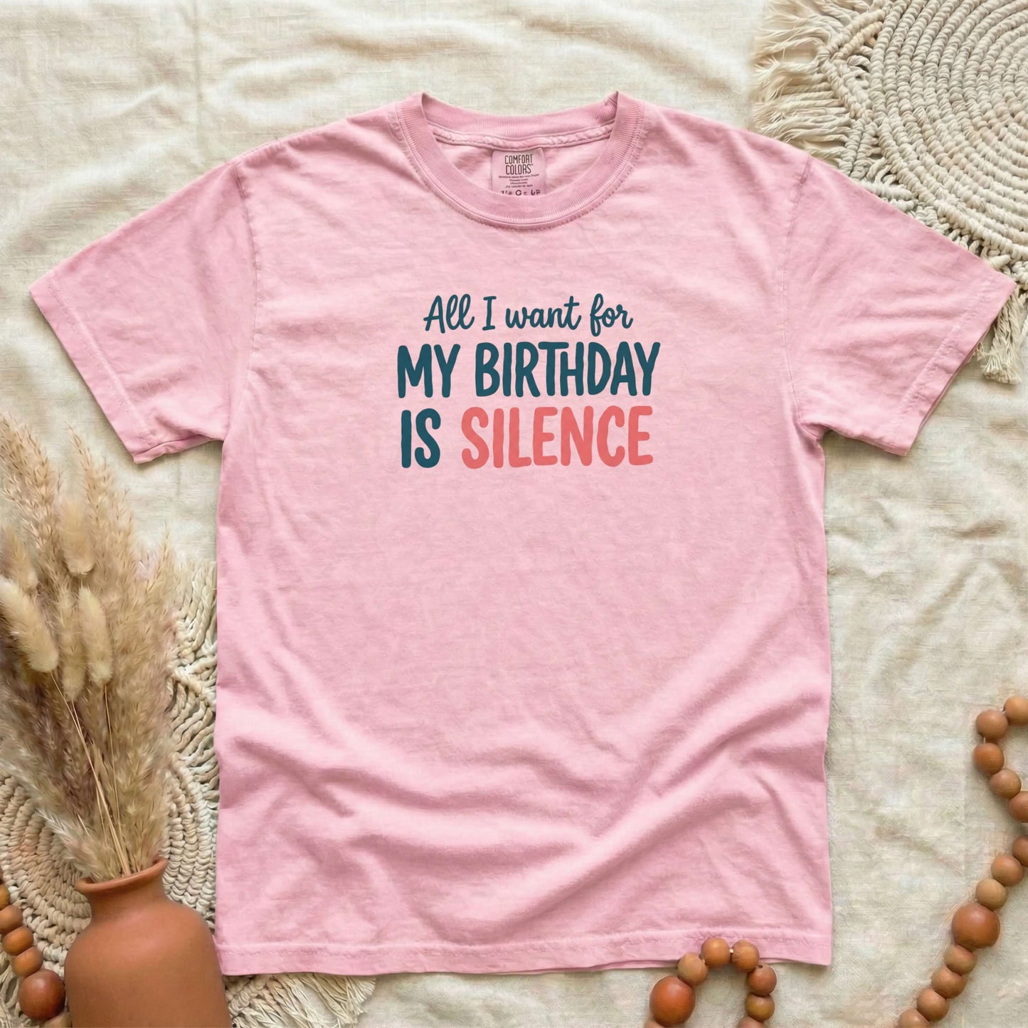 Blossom garment-dyed cotton tee printed with "All I Want For My Birthday Is Silence".