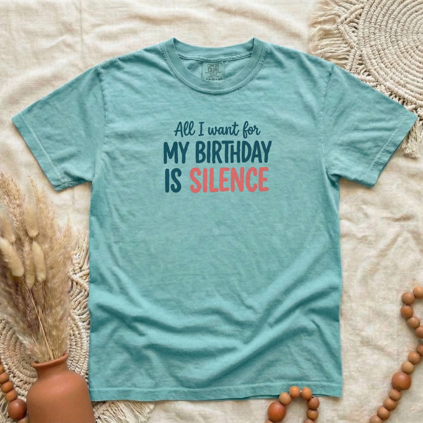 Chalky Mint garment-dyed cotton tee printed with "All I Want For My Birthday Is Silence".