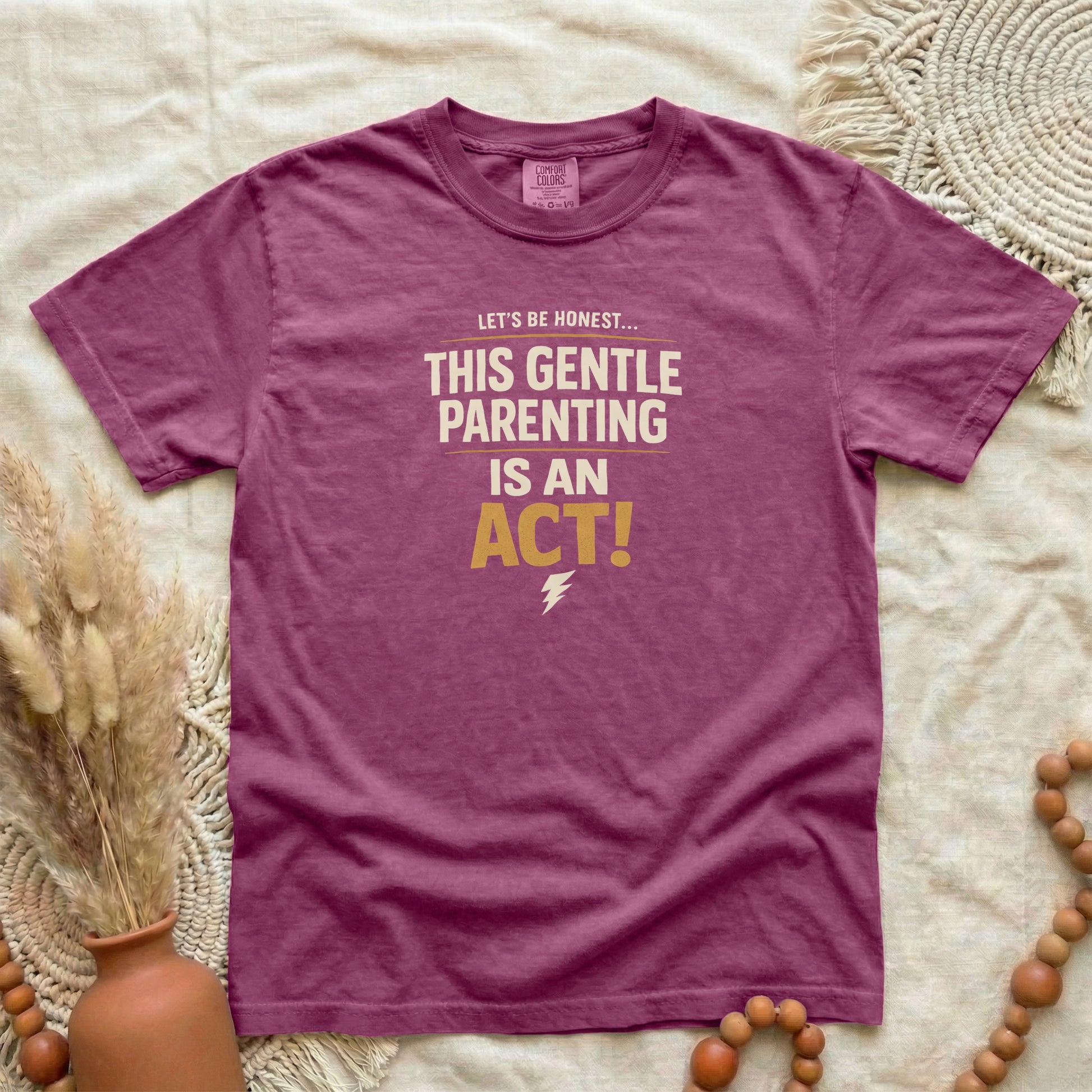 Berry garment-dyed cotton tee printed with "This Gentle Parenting Is An Act".