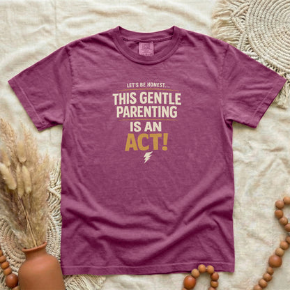 Berry garment-dyed cotton tee printed with "This Gentle Parenting Is An Act".