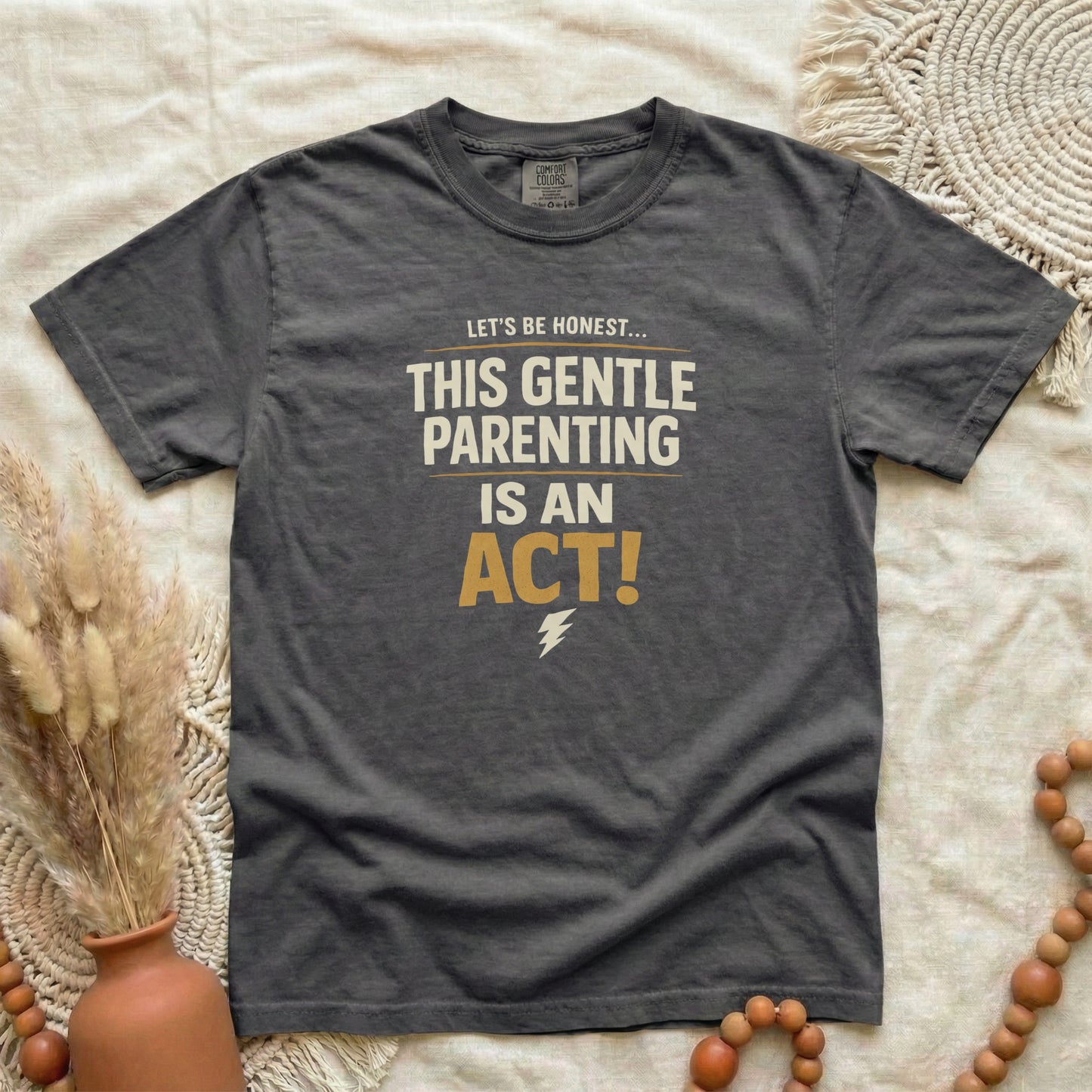 Pepper garment-dyed cotton tee printed with "This Gentle Parenting Is An Act".