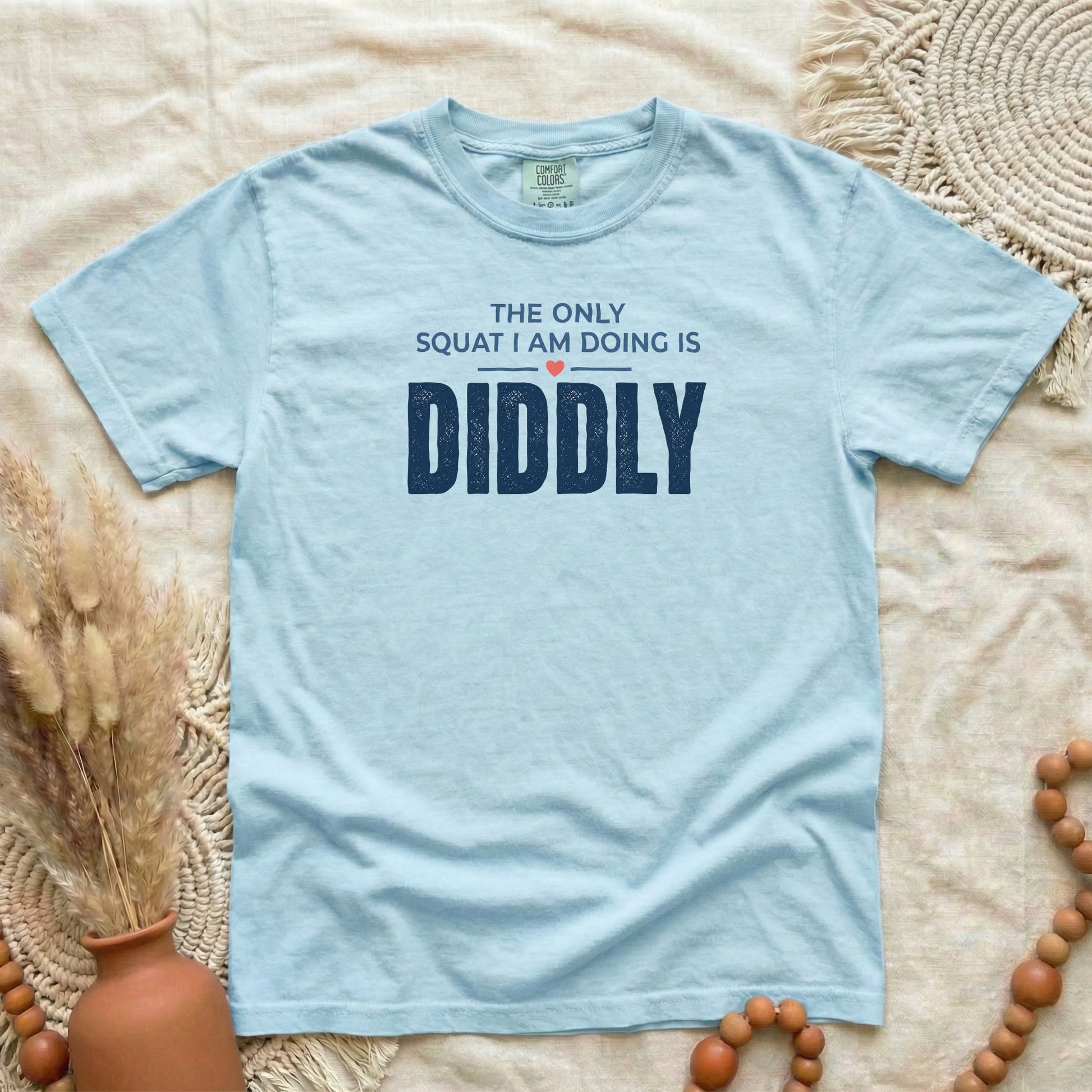 Chambray garment-dyed cotton tee printed with "The Only Squat I Am Doing Is Diddly".
