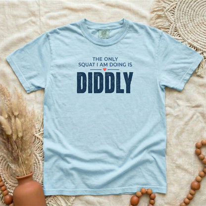 Chambray garment-dyed cotton tee printed with "The Only Squat I Am Doing Is Diddly".