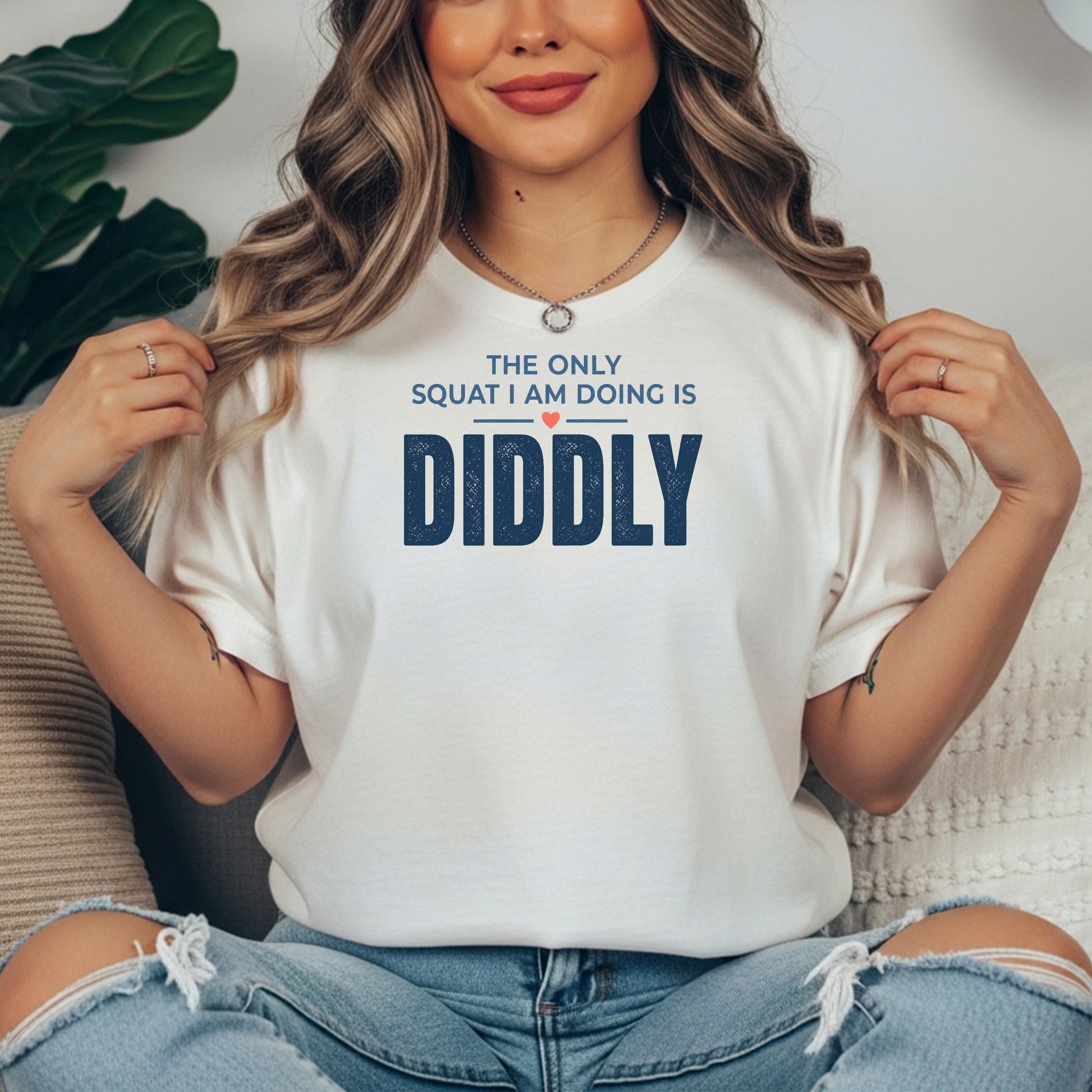 White garment-dyed cotton tee printed with "The Only Squat I Am Doing Is Diddly".