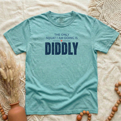 Chalky Mint garment-dyed cotton tee printed with "The Only Squat I Am Doing Is Diddly".