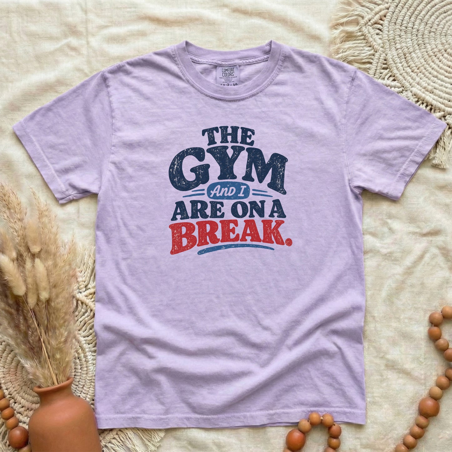 Orchid garment-dyed cotton tee printed with "The Gym And I Are On A Break".