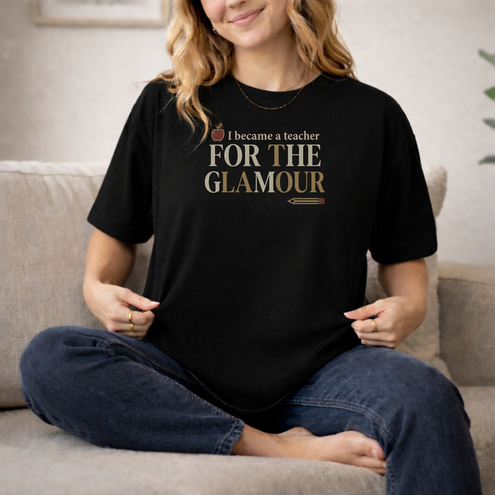Black garment-dyed cotton tee printed with "I Became A Teacher For The Glamour".