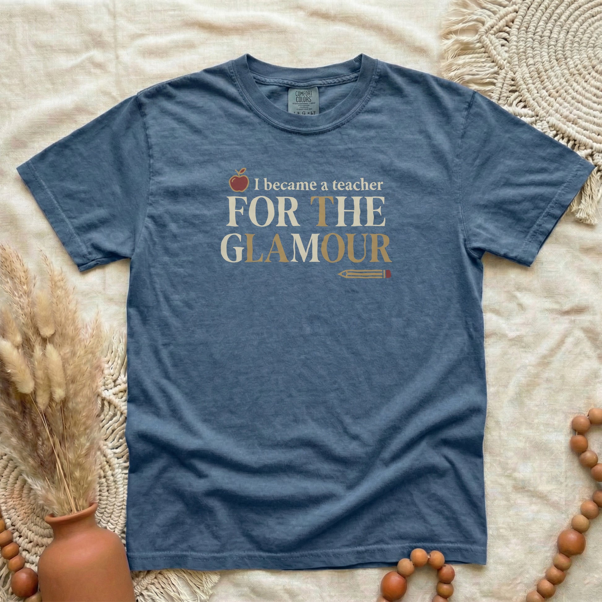 Denim garment-dyed cotton tee printed with "I Became A Teacher For The Glamour".