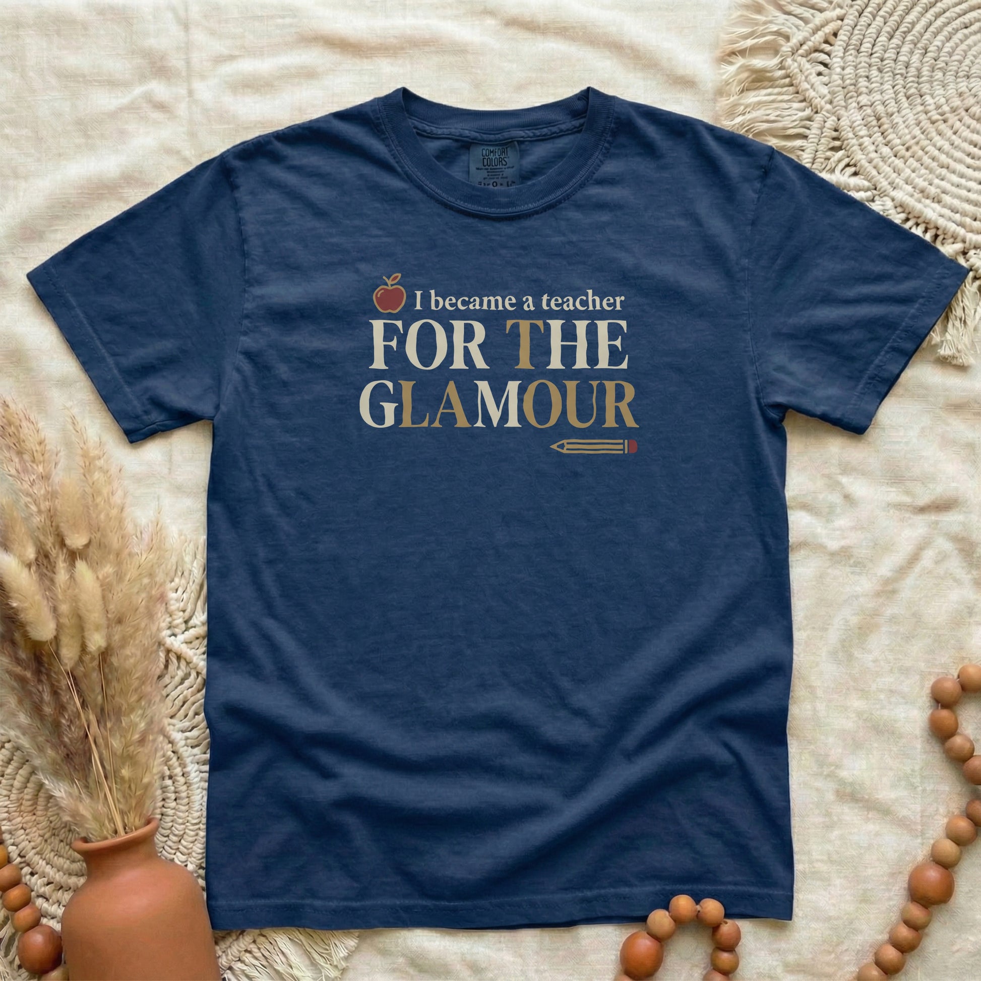 True Navy garment-dyed cotton tee printed with "I Became A Teacher For The Glamour".